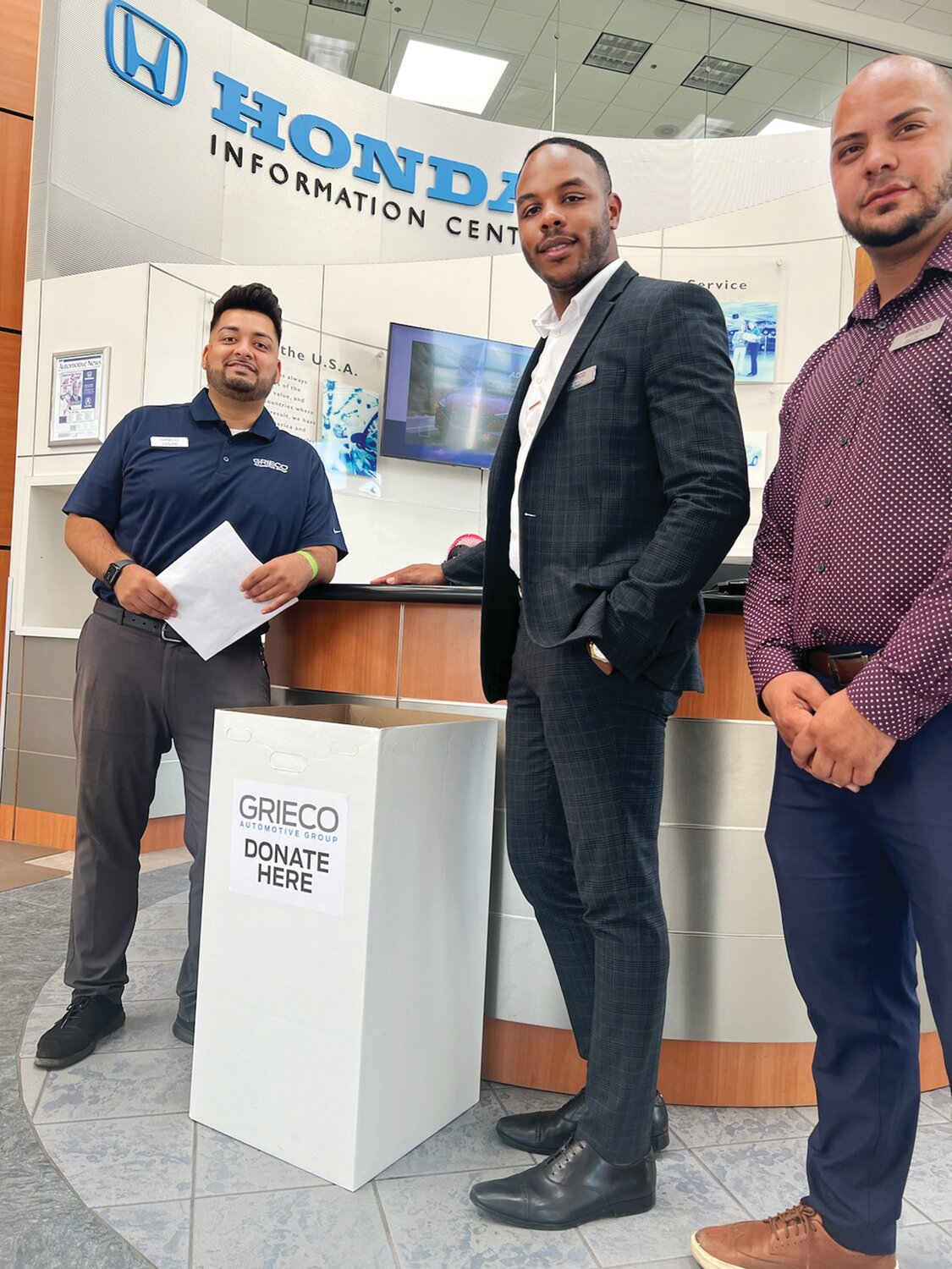 BACK TO SCHOOL: From left to right Brandon Melgar, John Abutu Jr. and Edison Mercardo are hoping you stop by to see them at one of Grieco Automotive Group’s dealerships in Johnston, East Providence, Middletown or Seekonk to donate school supplies.